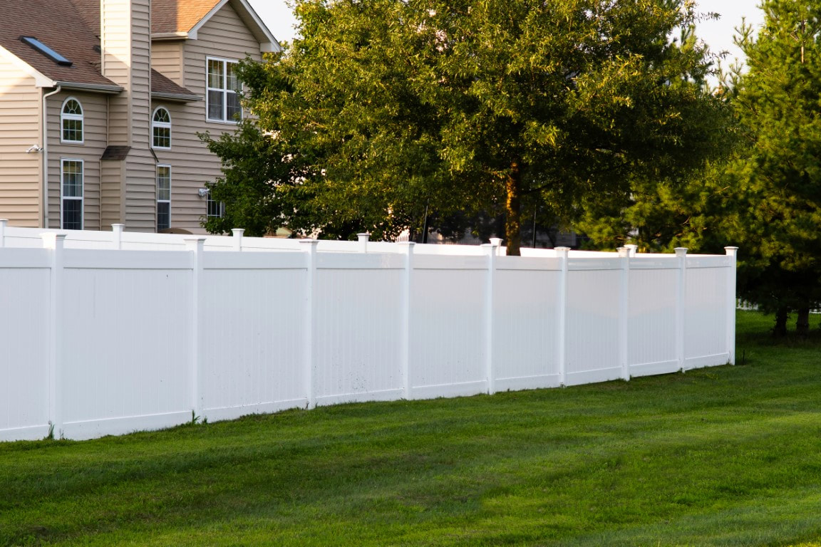 An image of a white vinyl fence